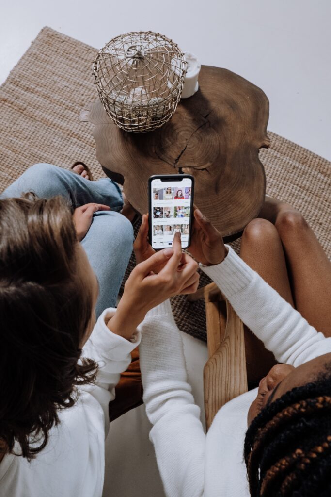 Social Media Marketing Agency team members scrolling through a social media newsfeed